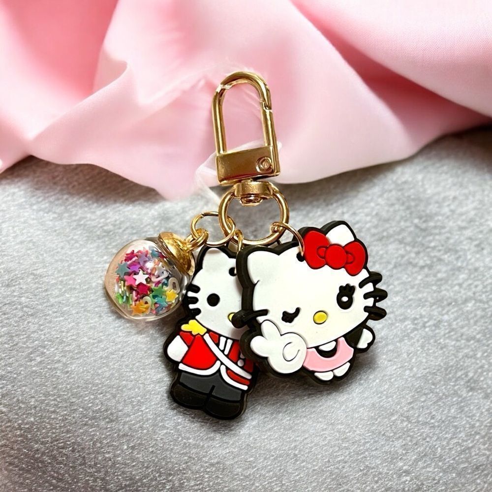 Hello Kitty Winking Confetti Ball Gold Tone Bag Charm Zipper Pull